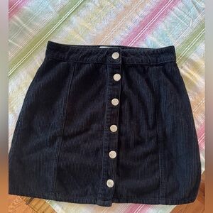 Miss Selfidge snap up mini skirt